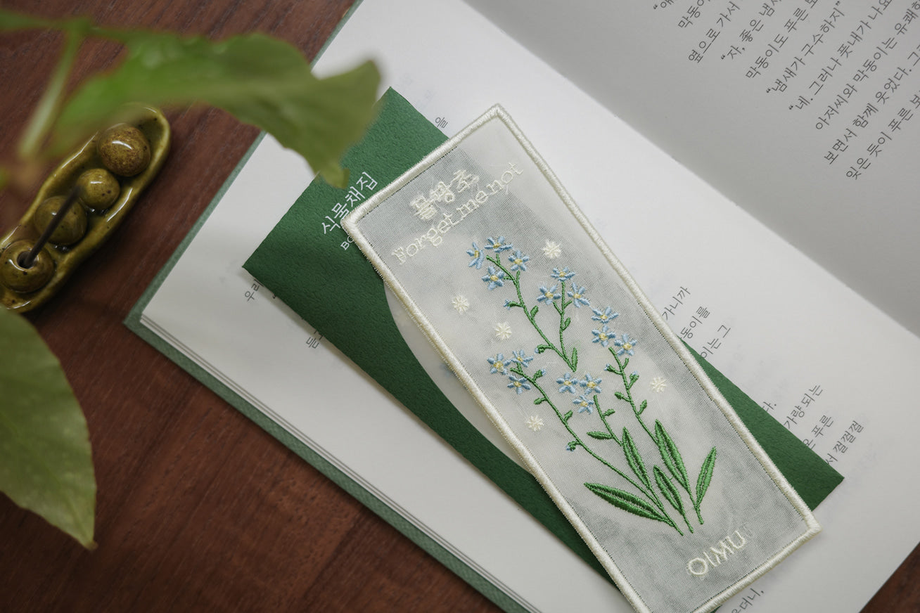 Plant Collecting Bookmark in Forget Me Not