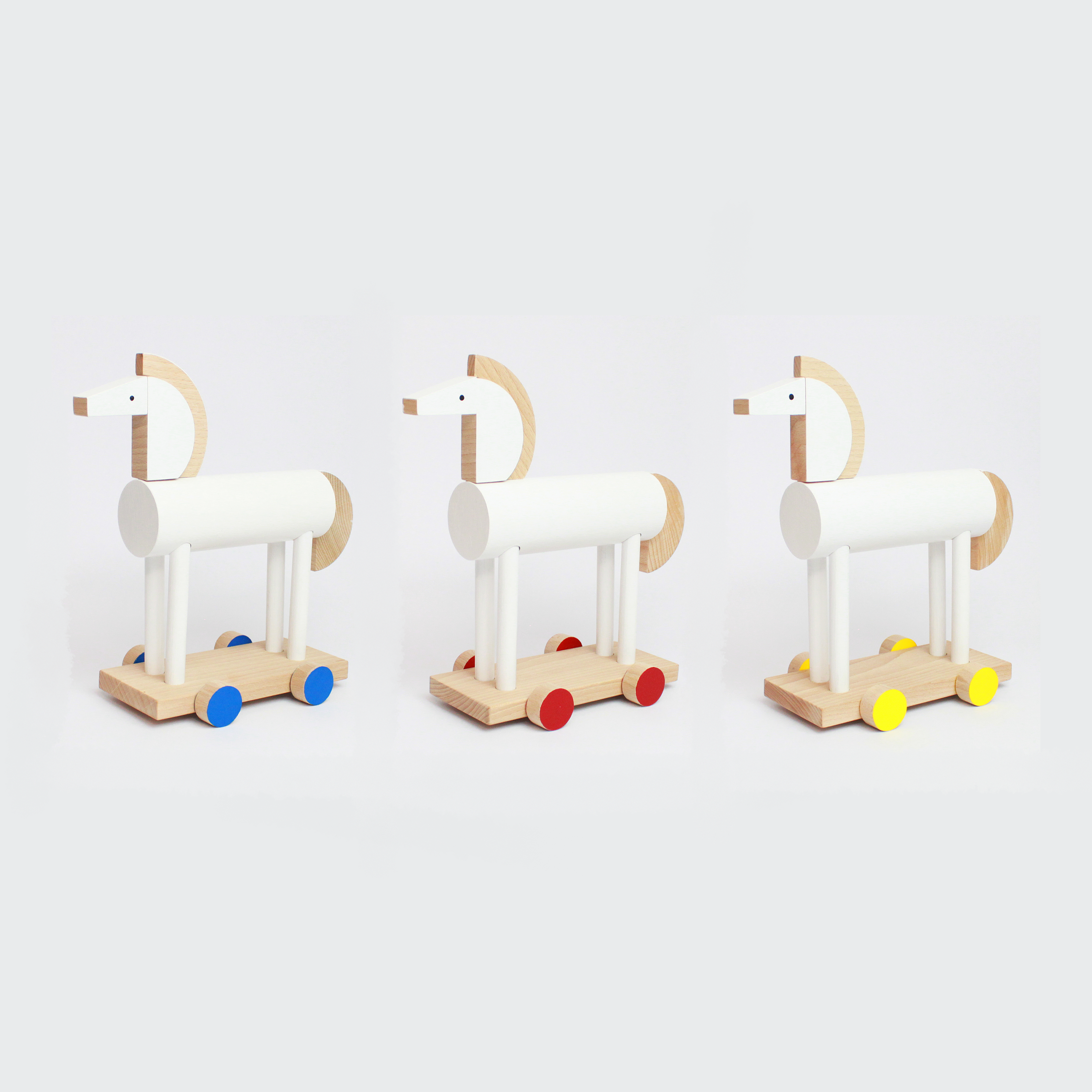 Mini Wooden Riding Horse Toy in White & Yellow Wheels